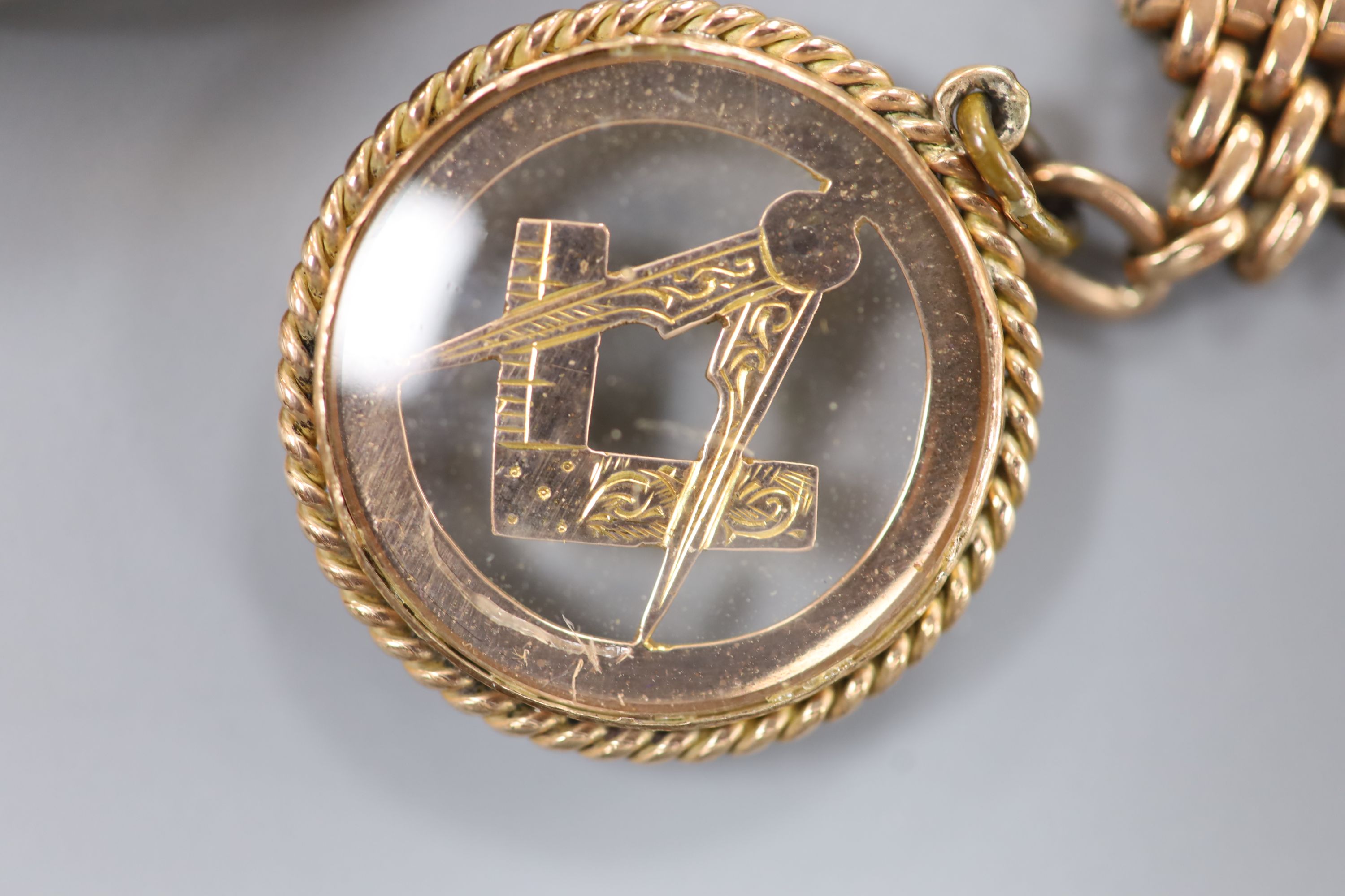 A 20th century 9ct gold hunter keyless pocket watch, on a 9ct gold chain with masonic charm